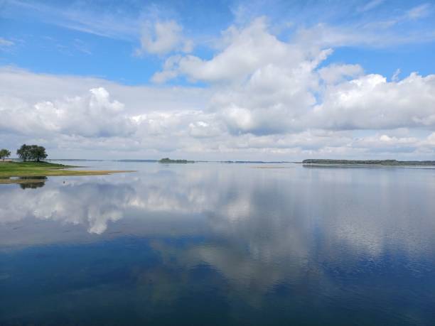 istock Scenic view of a tranquil lake surrounded by green trees 1714595307