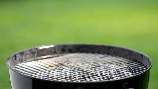 istock Barbecue grill on green background 1714600705