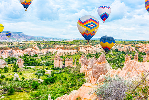Air balloons in Unique natural place in Cappadocia - Valley of Love, Turkiye.