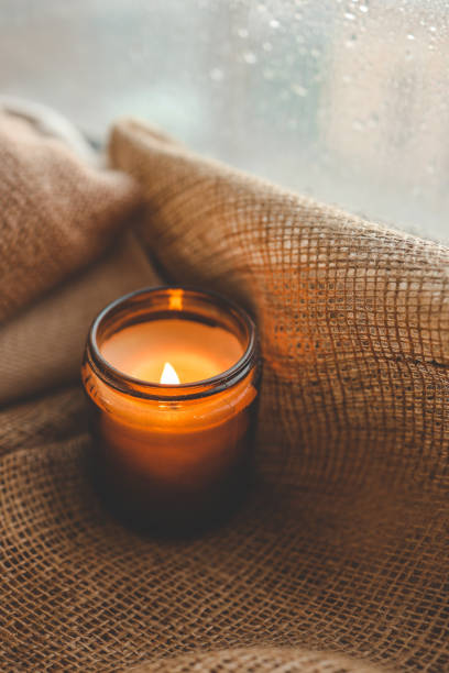 istock Burning candle close-up by the window 1714612320