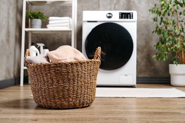 istock Washing machine in a gray modern laundry room 1714626796