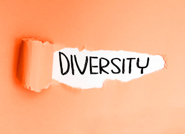 istock Diversity, written in English on torn, soft-toned paper. 1714638480