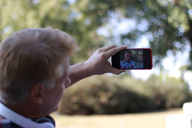 istock Mid aged blonde man take a selfie 1714646945