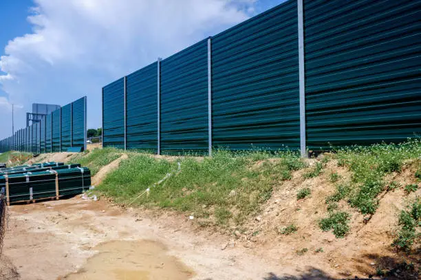 Installation of a wall and barrier against the noise of intense traffic on the roads that cross inhabited areas.