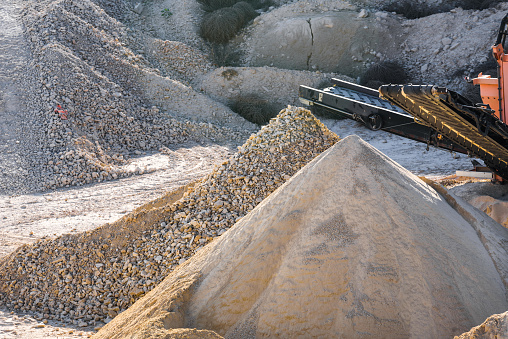 Machinery in a rock quarry to crush and sand the stone.