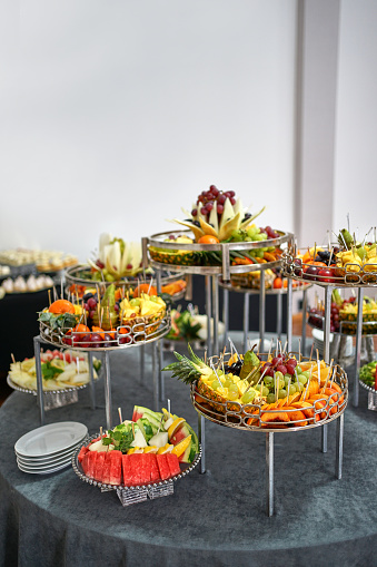 Beautifully decorated fruit buffet table. Festive decoration of the fruit table.