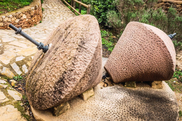 istock Old traditional stone millstones, exposed outdoors in Spain. 1714680596