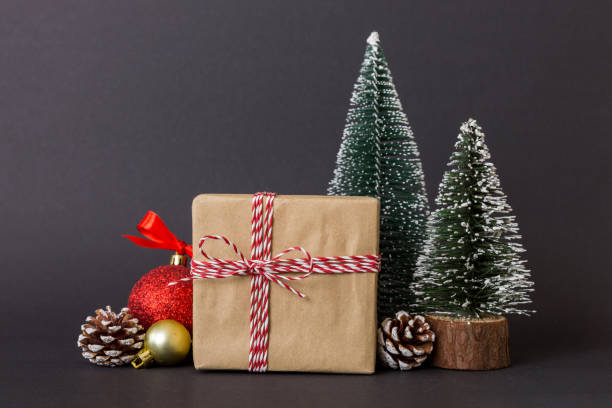 istock Christmas composition. Gifts, small tree, branches and craft DIY decorations on white background. New year concept. Christmas home decoration Flat lay, top view, copy space 1714685081
