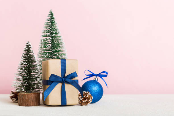 istock Christmas composition. Gifts, small tree, branches and craft DIY decorations on white background. New year concept. Christmas home decoration Flat lay, top view, copy space 1714685089
