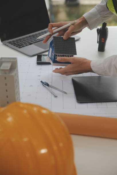 istock Engineer Teamwork Meeting, Drawing working on blueprint meeting for project working with partner on model building and engineering tools in working site, Construction and structure concept. 1714694511