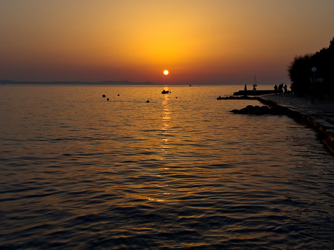 View from the restaurant into the sunset on the Adriatic Sea in Croatia. Summer, vacation.
