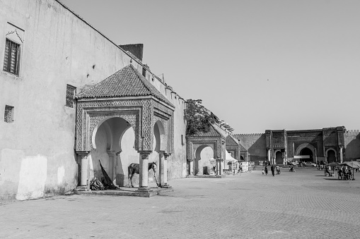 Meknes, Morocco – September 04, 2018: The Place el Hedim, the main square in the old city of Meknes, Morocco, North Africa in grayscale