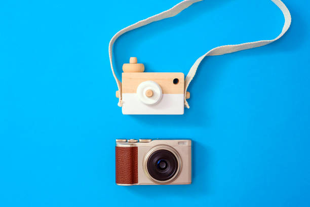 istock Two cameras, one modern and one old, compared one next to the other, for photography academies, isolated in background. 1714729395