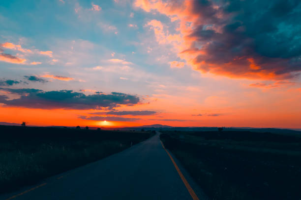 istock Golden sunset on the country road 1714737862