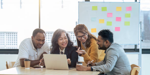 istock Diverse businesspeople gathered in the office having fun during brainstorming while discussing new ideas for their new project 1714743504