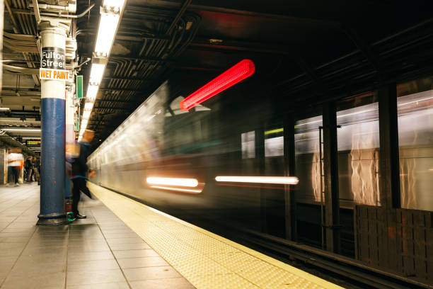 istock Subway train approaching to Fulton St. Station 1714777285