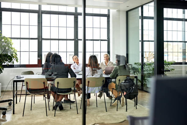 istock Project team meeting in glass conference room 1714781966