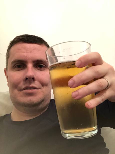 istock A celebration Christmas Day selfie with a beverage in hand 1714784141