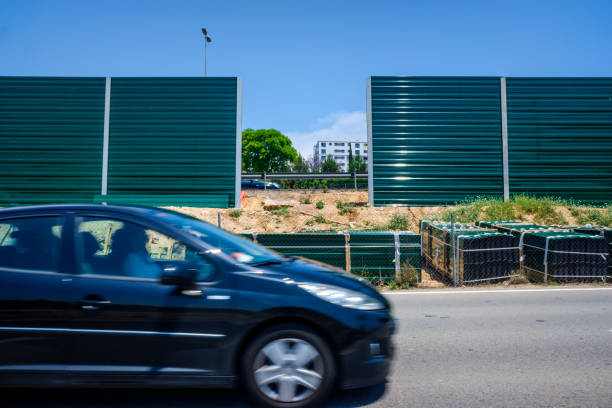 Valencia, Spain - June 9, 2021: Construction material next to a noisy road to isolate nearby homes from noise.