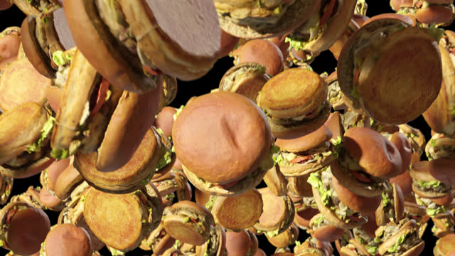Looped Video of Falling Burgers with Alpha Channel. 3D rendering.