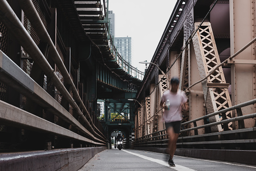 Woman running on Queensboro Bridge