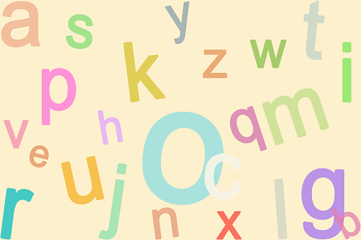 An array of vibrantly multicolor alphabet letter are scattered randomly on a warm, beige background, creating a playful, intellectual ambiance. The contrasting color stand out, inviting fun learning.