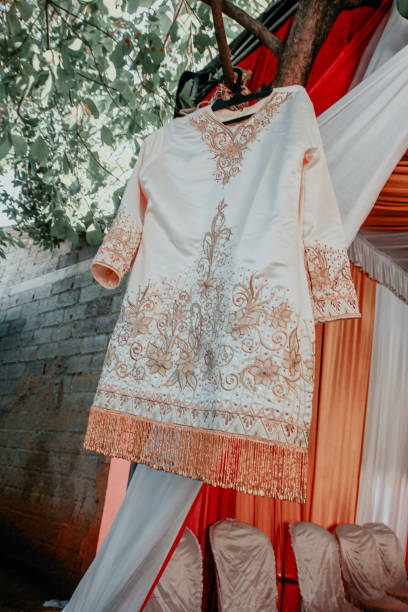 istock The bride's traditional dress is hanging on a tree branch 1714821216