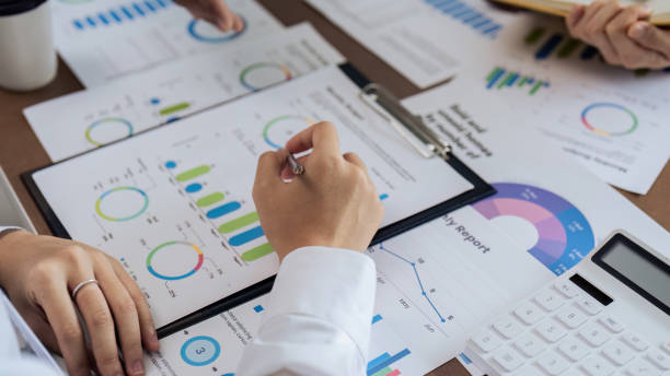 istock Teamwork with business people analysis cost graph on desk at meeting room. 1714840139