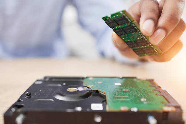 istock Motherboard, microchip and engineering hand closeup with electric maintenance of circuit board. Developer, IT and dashboard for electrical hardware update and technician with information technology 1714859577