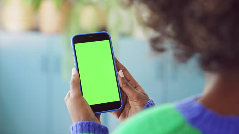 Woman using mobile phone at home