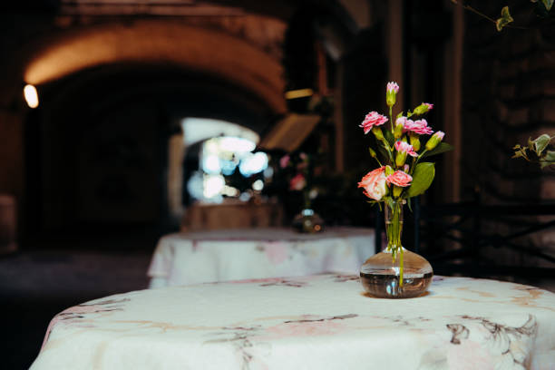 istock A small bouquet decorates empty tables in a European-style cafe for an intimate setting. 1714860689