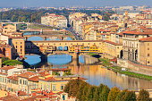 Panoramic view of medieval stone bridge Ponte Vecchio over Arno river in Florence, Tuscany, Italy. View from Michelangelo Hill