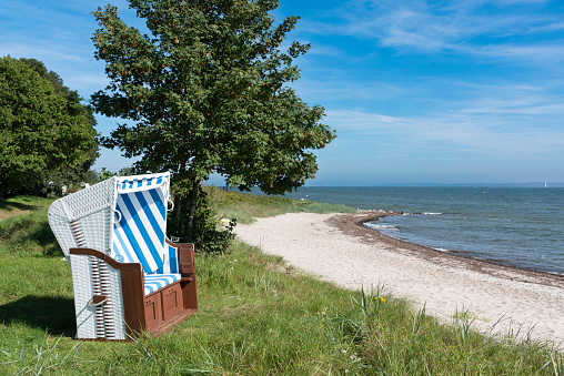 Beach chair on the Baltic Sea at Eckernförde Bay, Schleswig-Holstein, Germany