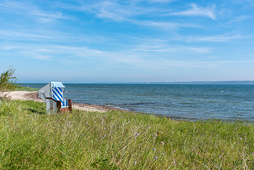Beach chair on the Baltic Sea at Eckernförde Bay, Schleswig-Holstein, Germany