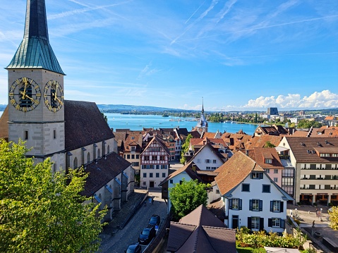 Zug old town. Zug is a city in central Switzerland and has arround 30'000 residents. The image shows some buildings in the historic center and the lake Zug, captured during summer season.