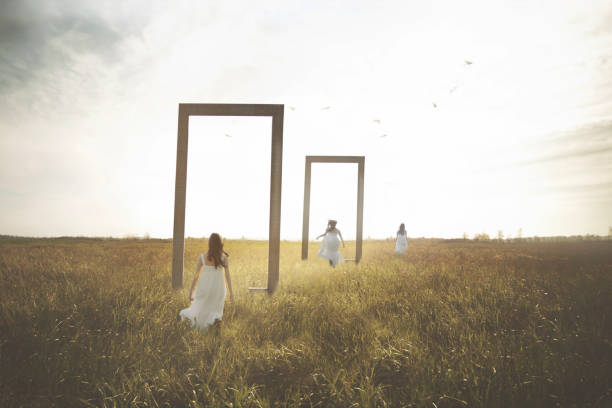 istock woman imagines herself in loop running through surreal doors in a field, abstract concept 1714901580