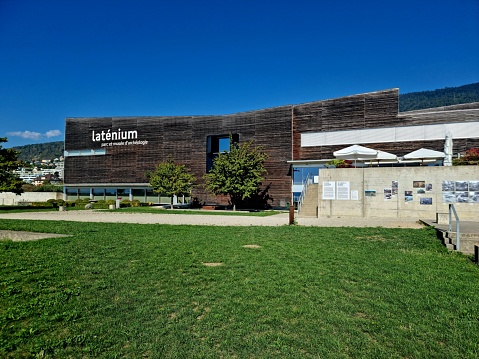 The Laténium is an archeology museum located in Hauterive, a suburb of Neuchâtel. The museum shows artefacts from the Upper Paleolithic, Bronze Age and Neolithic period. the image shows the museum captured during summer season.