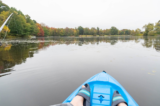 Autumn lake kayak fishing