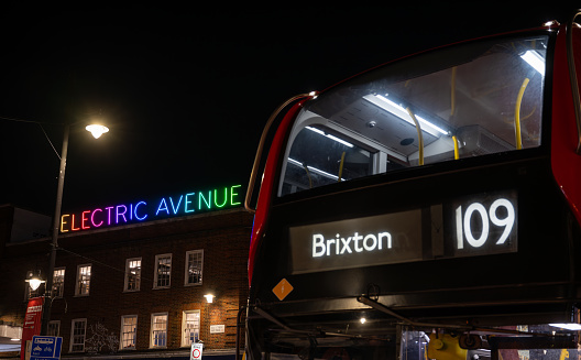 Brixton, London, UK: The 109 double-decker bus waiting at a bus stop on Brixton Road opposite Electric Avenue.