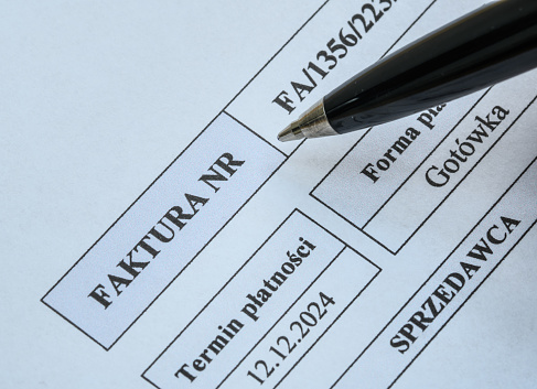 Sales document VAT invoice close up and pen