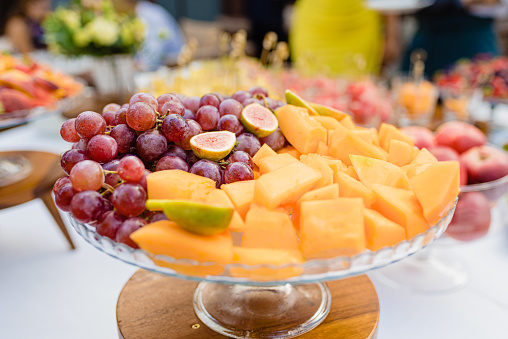 Fresh fruit cut and displayed on a table to taste.