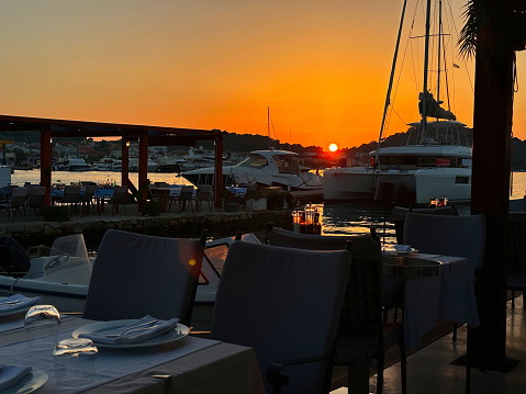 View from the restaurant into the sunset on the Adriatic Sea in Croatia. Summer, vacation.