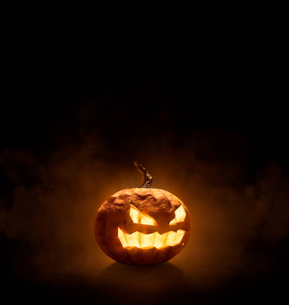 istock Halloween pumpkin, background orange smoke 1714926979