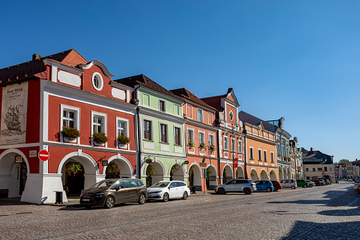 Litomysl, Czech Republic, 29 September 2023: Smetana Square or picturesque Smetanovo namesti with medieval colorful gothic merchant houses at sunny day, historic renaissance and baroque buildings.
