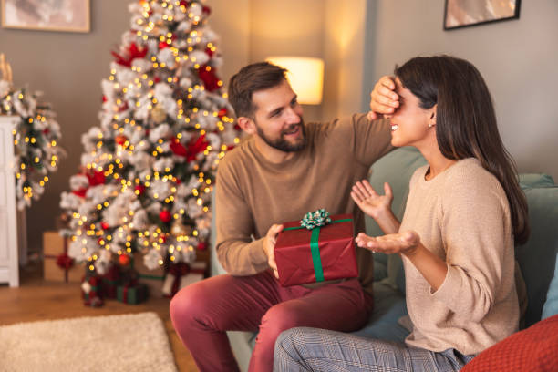 istock Couple exchanging Christmas presents 1714937660