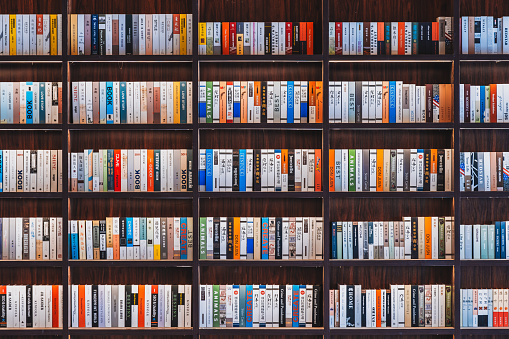 Bookshelf with books in the interior of a bookstore or library