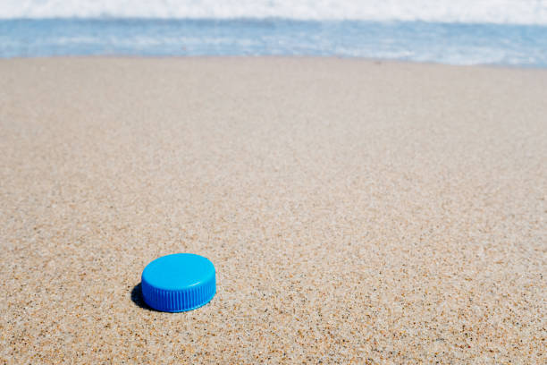 istock Plastic plug on the clean sand of a beach. 1714942882