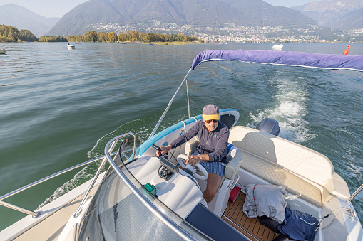 Senior man enjoying retirement with his boat
