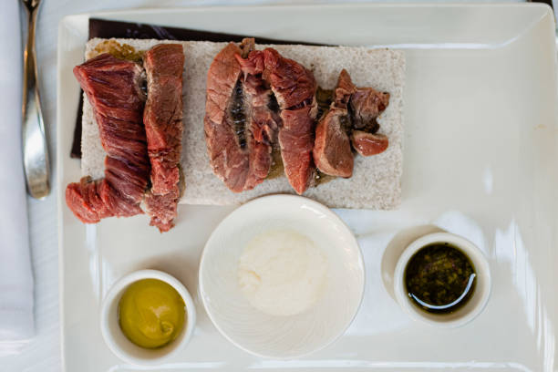 istock Raw beef fillets served before a hot stone grill to be cooked live. 1714944133