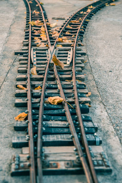 istock Small abandoned train tracks are a game for children. 1714955507